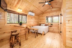 Lancaster Cabins - One Roomer Model Log Cabin - Interior with Bathroom